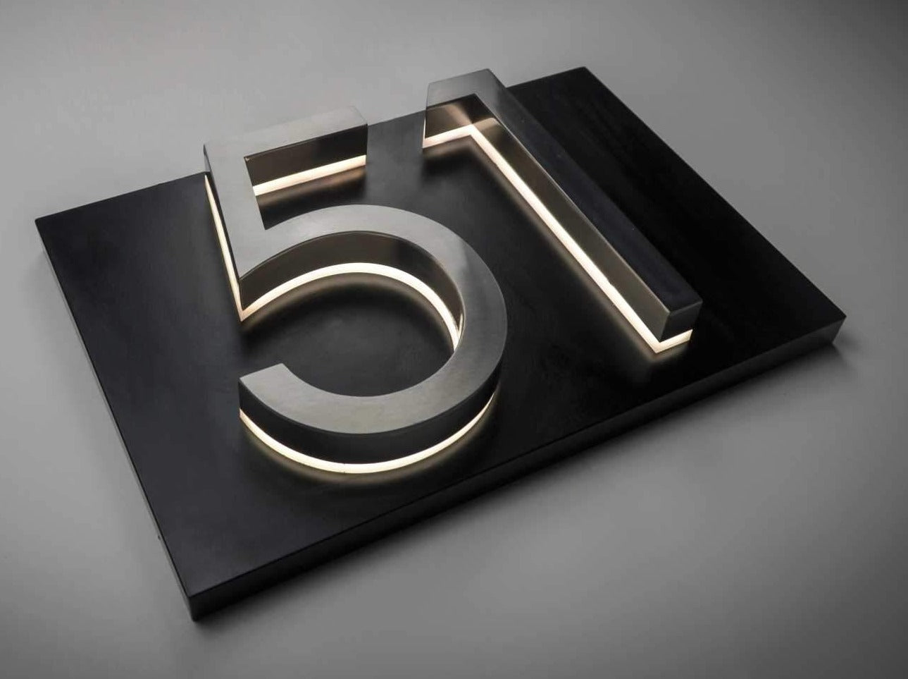 Brushed Silver LED House Numbers on a Black Metal Backer Plate